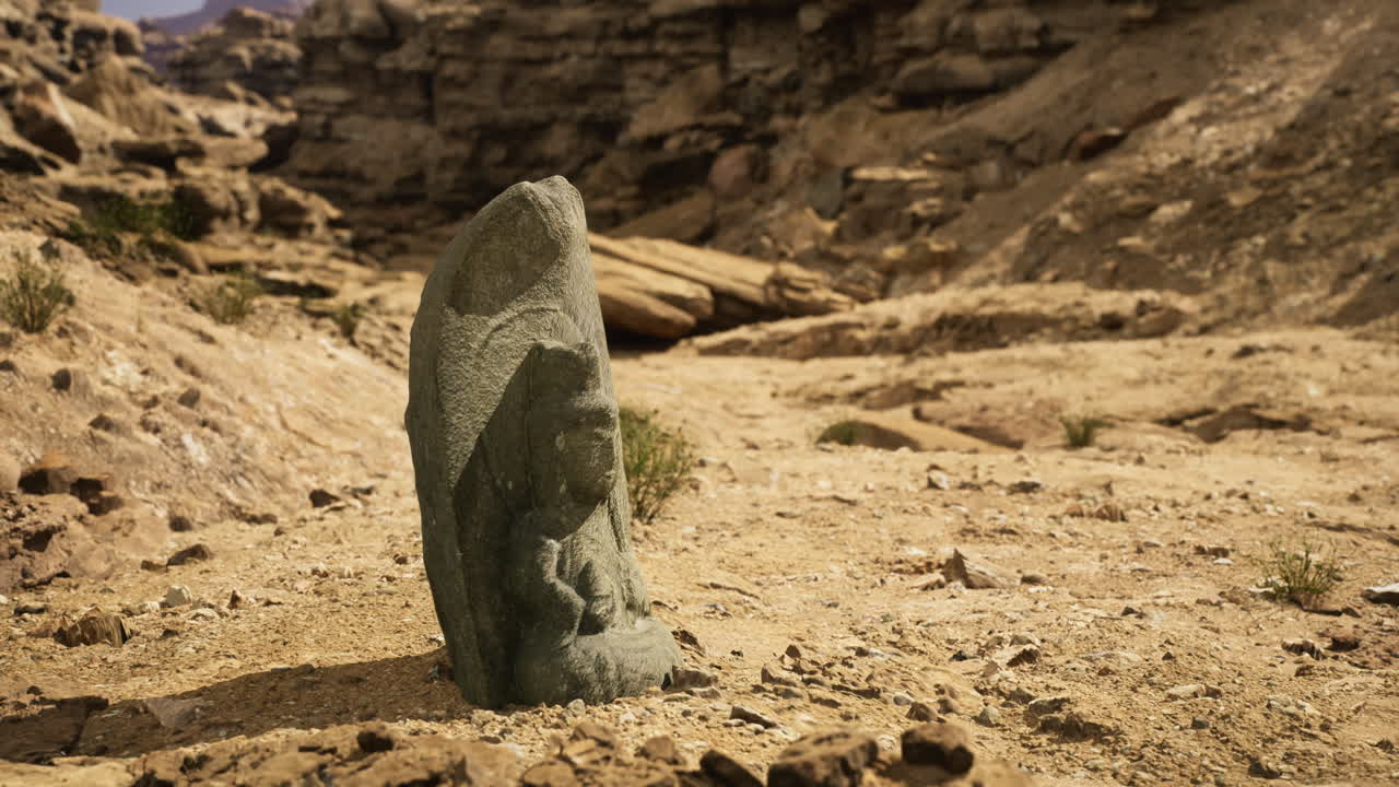 Ancient stone carving stands alone in arid landscape