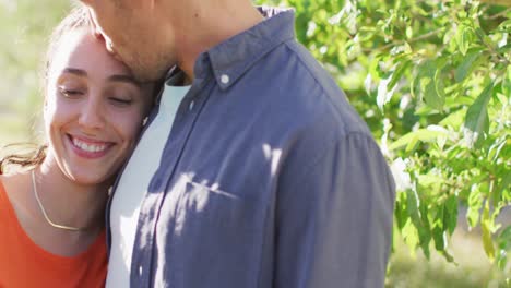 Happy-caucasian-young-couple-hugging-and-spending-time-outside