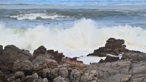 waves breaking on rocks at betty's bay, western cape, south africa