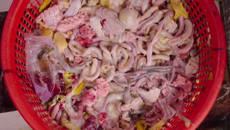 raw chicken organs in a basket