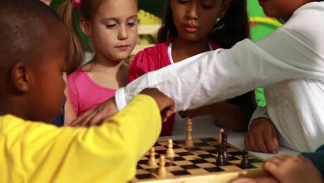 preschool class learning how to play chess