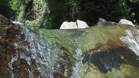 Close-up-of-pure-crystal-water-waterfall-in-forest