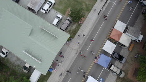 Aerial-drone-over-several-tents-and-shelter-a-farmers-market,-USA,-South,-America