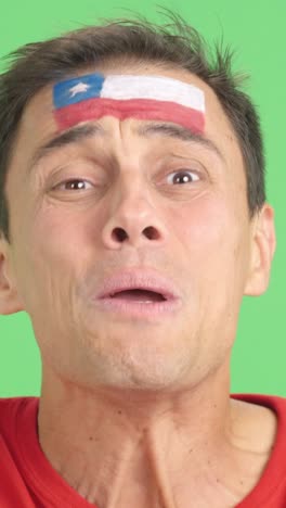 very nervous man supporting chilean team during a difficult match