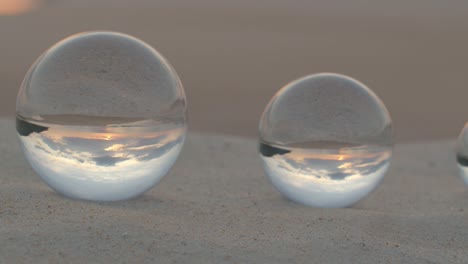 crystal balls sphere reveals sunset seascape