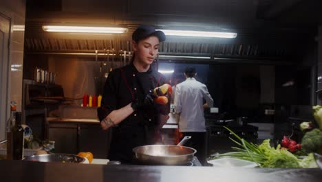 chef cooking vegetables and eggs in a kitchen