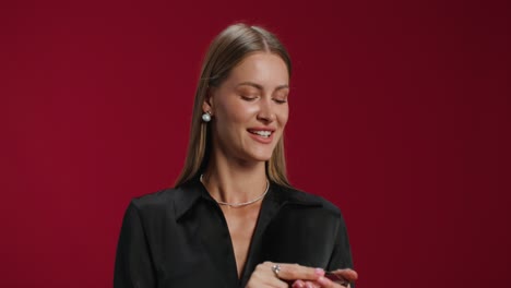 woman holding makeup brush and gift box