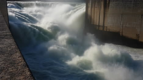powerful water flowing from a dam's spillway