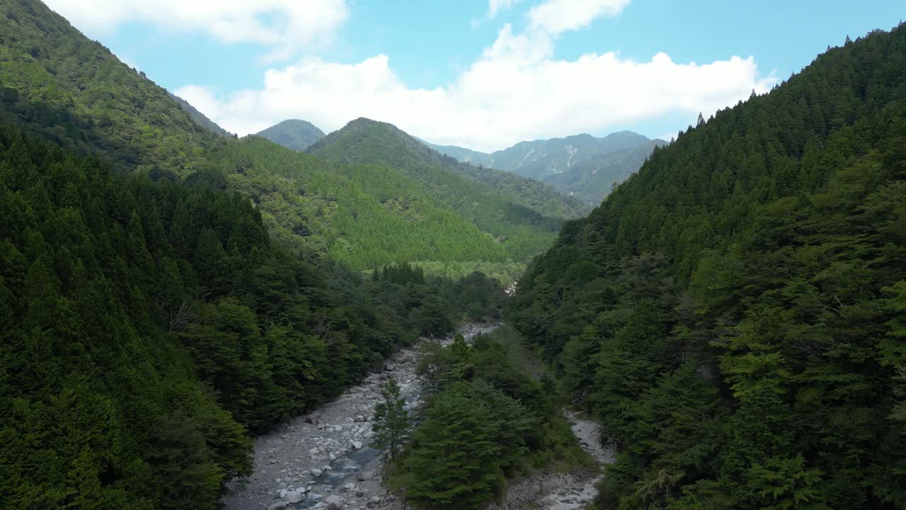 Beautiful wide open riverbed, aerial rising drone