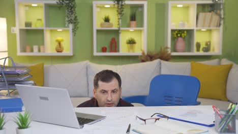 man with fear of work is unhappy and bored with busy and difficult work.