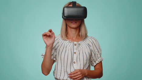 Woman-using-virtual-reality-futuristic-technology-VR-headset-helmet-to-play-simulation-3D-video-game