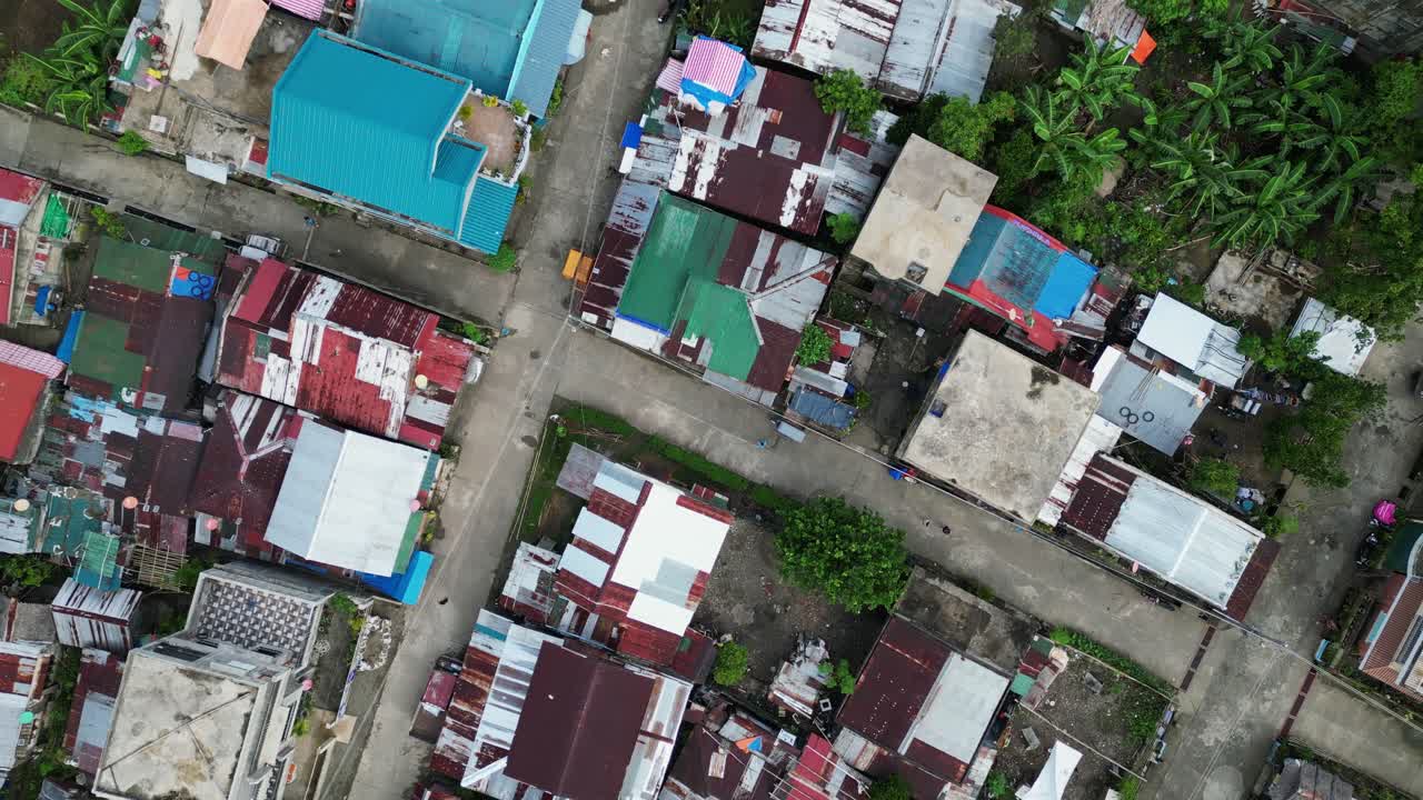 Aerial top shot of colorful homes packed tightly in Virac rural center with narrow roads