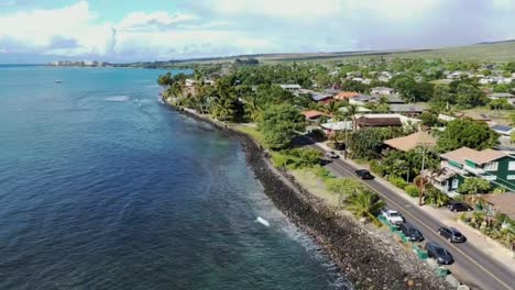 Cars-driving-along-coastline-in-urban-area