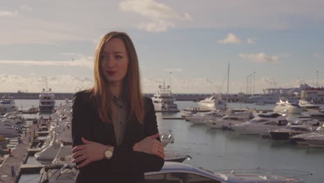 woman in business suit by the harbor