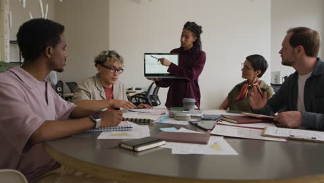 diverse business team in a collaborative meeting with a presentation
