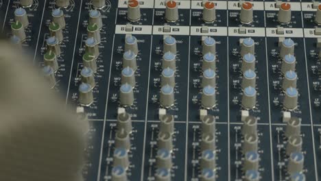 close up of a professional audio sound mixer in a recording studio