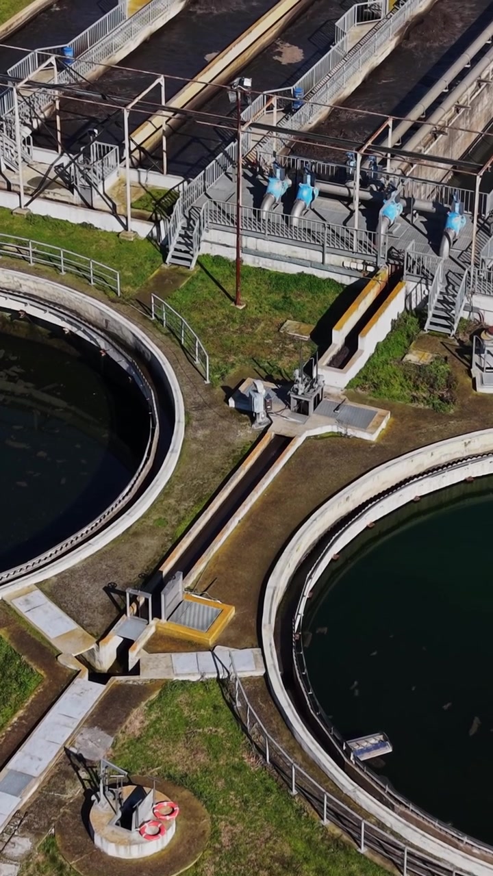 Water treatment facility with multiple circular tanks and machinery