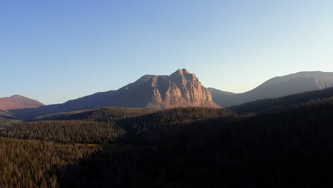 stunning aerial drone landscape nature dolly out shot of the beautiful red castle lake mountain up in the high uinta's between utah and wyoming on a backpacking trip on a clear summer evening