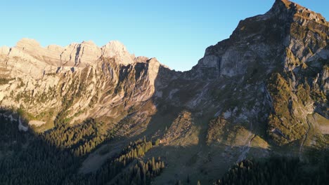 aerial drone view of obersee fronalpstock glarus näfels, rocky mountains with blue sky