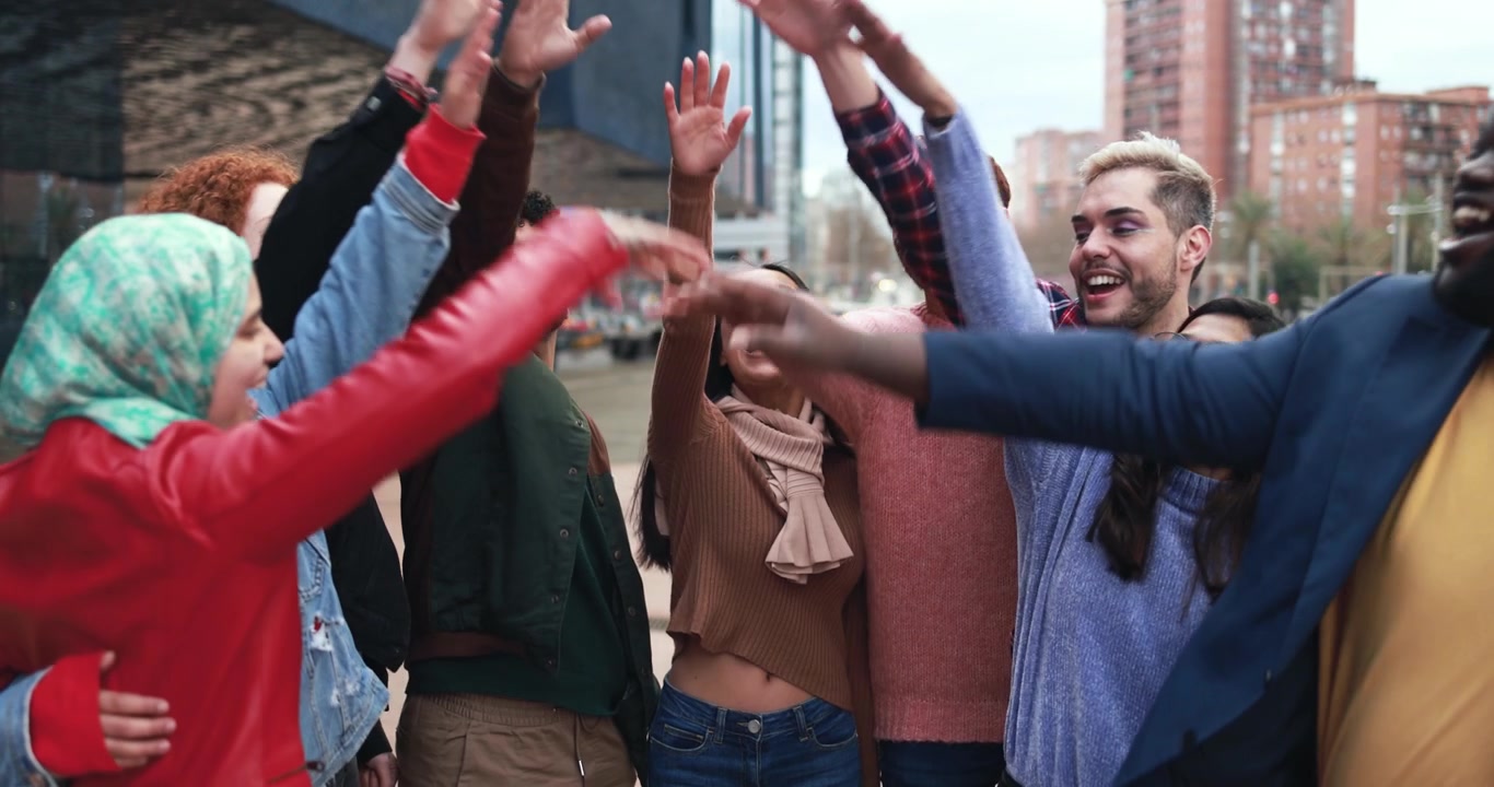 Diverse Group of Young Friends Celebrating Together Outdoors