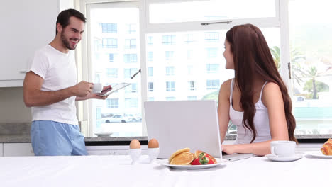 Attractive-couple-having-breakfast-together