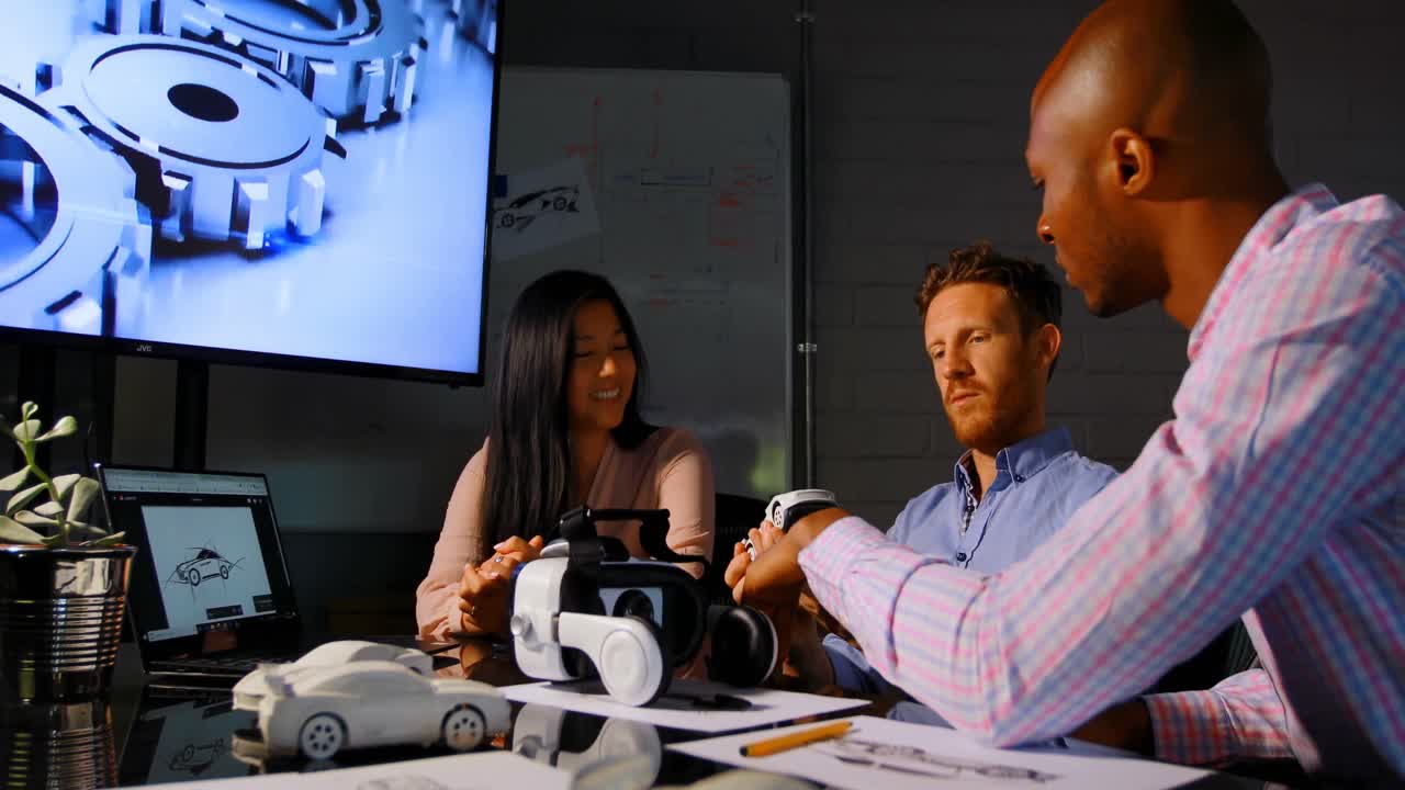 Business colleagues discussing over car model 4k