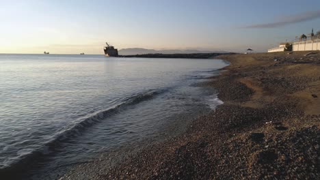 sunrise at the beach with a shipwreck