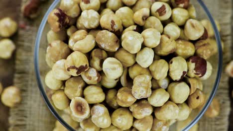 peeled hazelnuts on a rotating plate (seamless loopable)