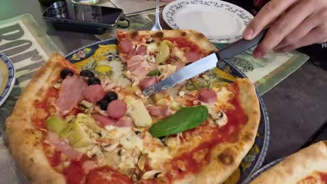 slicing and serving a delicious pizza