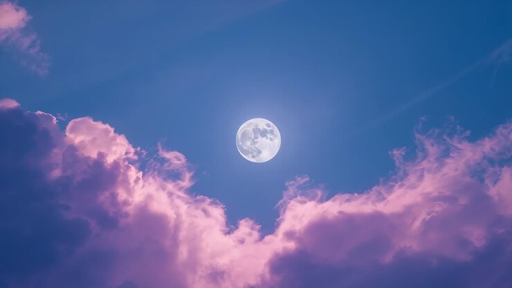 Starting with full moon centering against blue sky, pink clouds drifting, creating hypnotic motion