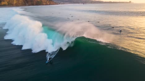 a surfer catches a 10-foot wave at blacks beach la jolla