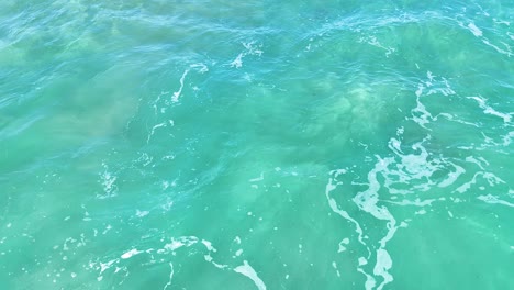 turquoise ocean waves gently moving at fingal head