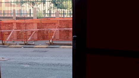 a door being opened to a street view