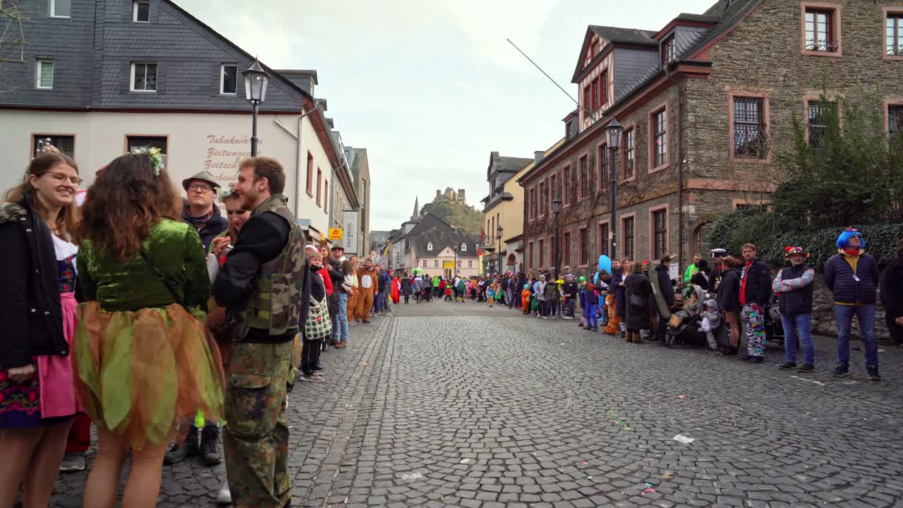 Crowd of Costumed German People Waiting For The Street Parade on Rose Monday Carnival