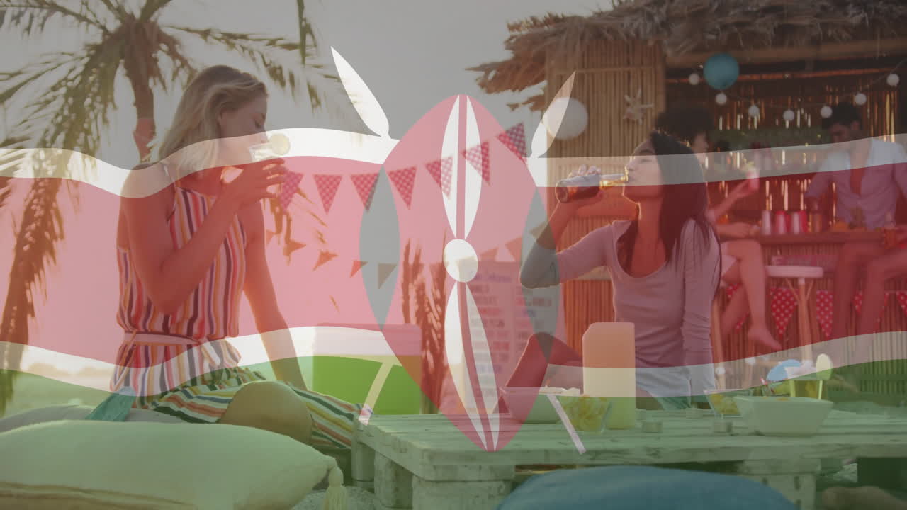 At beach bar, women holding drinks with Kenyan flag animation overlay