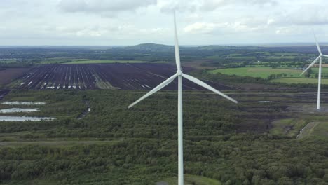 Cinematic-aerial-view-of-Wind-turbines-Energy-Production--4k-aerial-shot-on-sunset