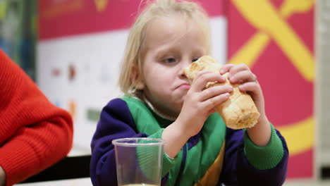 girl eating in a cafe