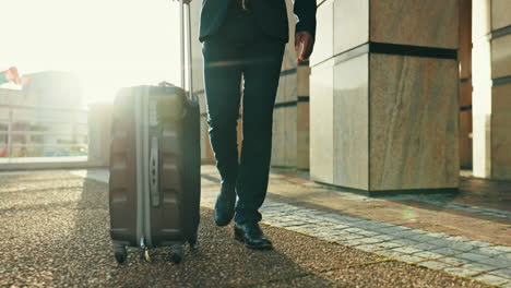 suitcase, business travel and feet of man in city