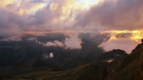 Low-clouds-over-a-highland-plateau-in-the-rays-of-sunset.-Sunset-on-Bermamyt-plateau-North-Caucasus,-Karachay-Cherkessia,-Russia.