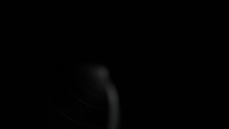 Silhouette Of Man Walking Towards Light In Dark Tunnel