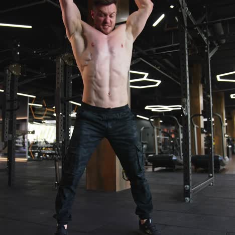 workout routine in gym. young handsome man doing exercises in the gym