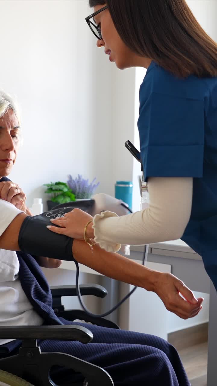 Nurse Checking Senior Woman's Blood Pressure