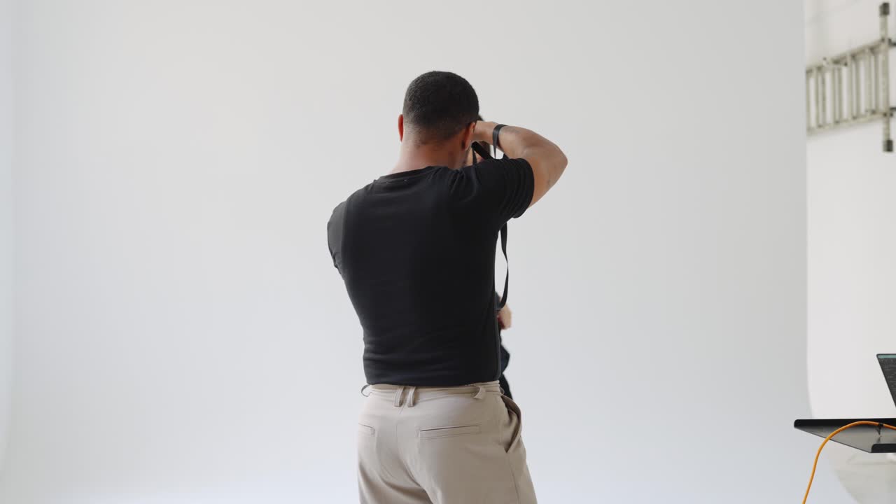 Behind the scenes of a fashion photo shoot in a studio
