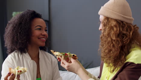 two friends eating at home