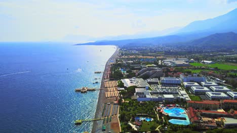 aerial 4k drone footage of kiriş- kemer , and mountains – filmed in a vibrant summer time