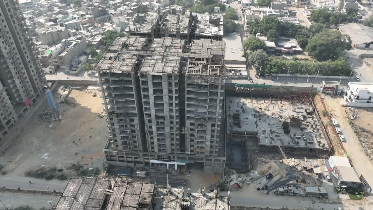 Aerial drone view of a multi-storey building under construction in Karachi, Pakistan