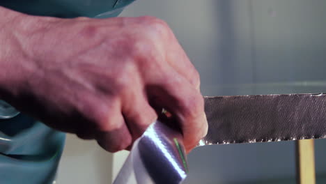 applying foil tape to glass surface