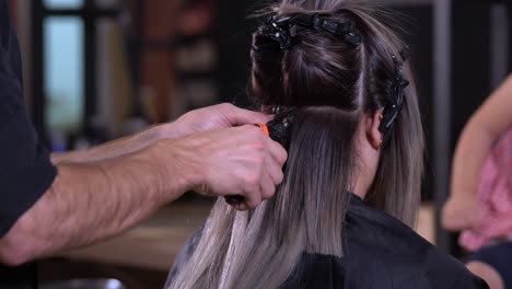 hair extension installation in a salon by a hairdresser