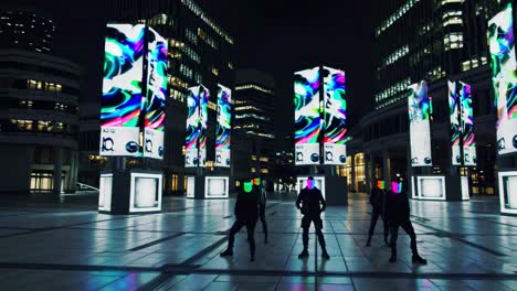 urban night performance with masks and led displays