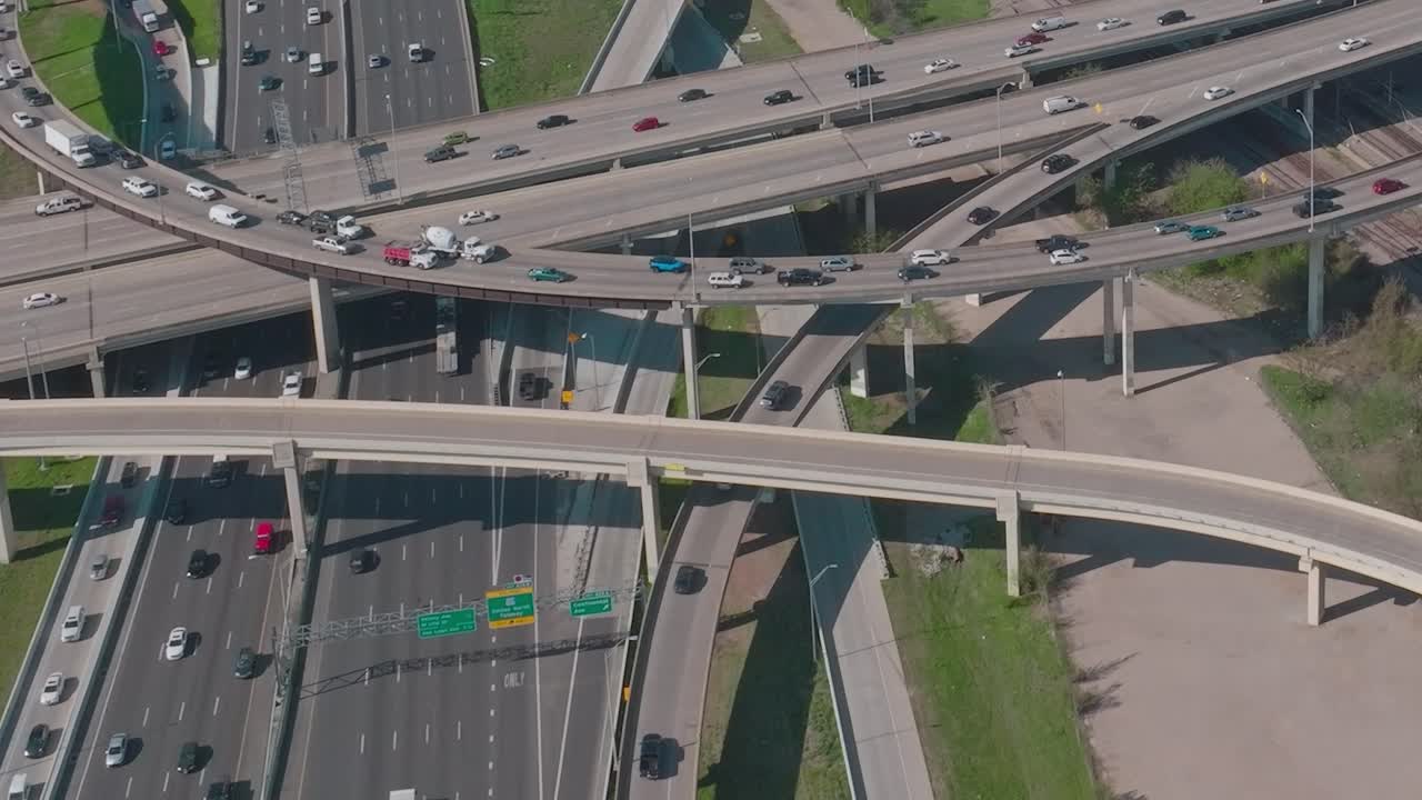Traffic flows through highways in downtown Dallas, Texas in aerial view